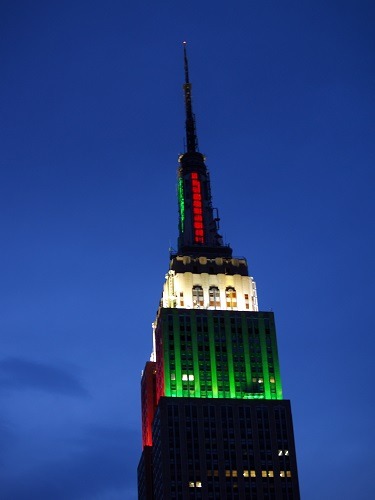 Empire State Building lit up red and green