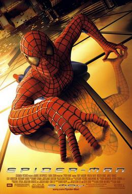 Spider-Man in his famous suit, crawling over a building and looking towards the viewer. Below of him is New York City