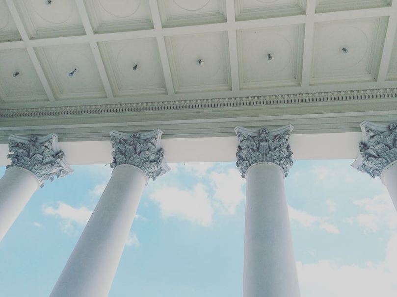 A Low-angle Picture of Corinthian Style Columns.