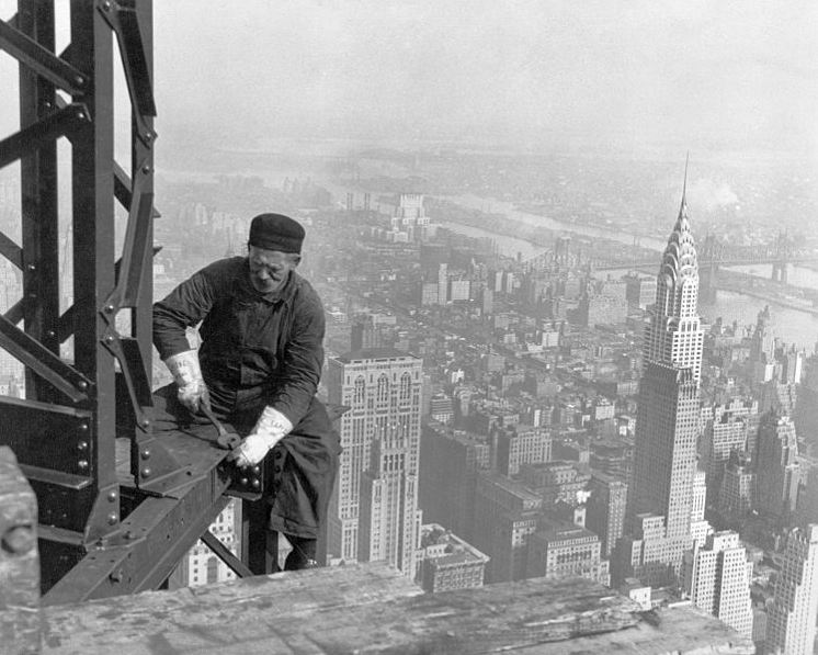 a structural worker at work on the steel structure of the Empire State Building