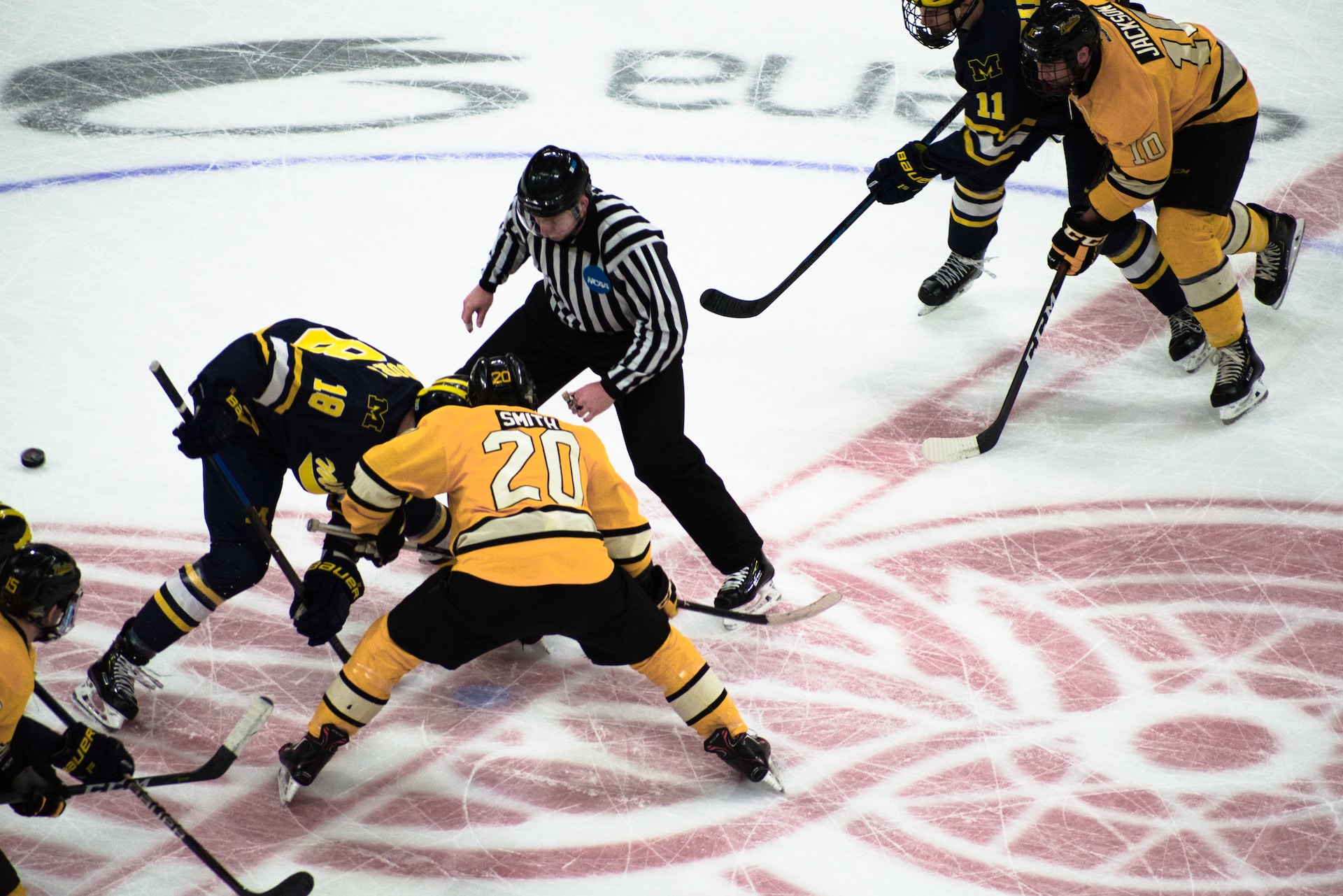 ice hockey players in yellow and black