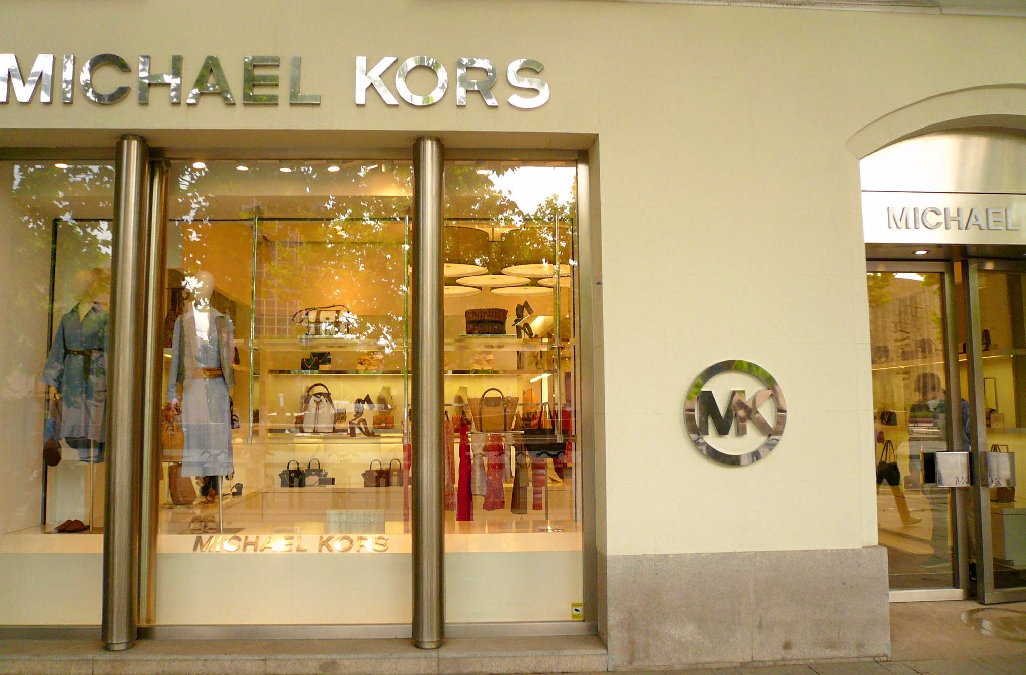 Michael Kors shop with MK logo on the wall