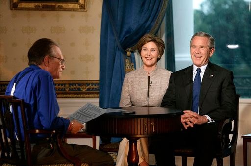 Larry King interviewing President George W. Bush and First Lady Laura Bush in 2006