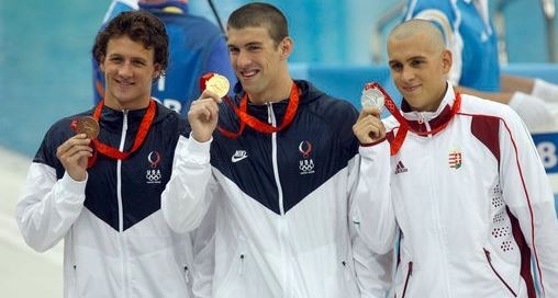 An image of Lochte, Phelps, and Cseh in the 2008 Summer Olympics