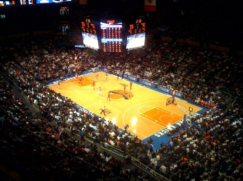 An overview of a basketball game inside Madison Square Garden