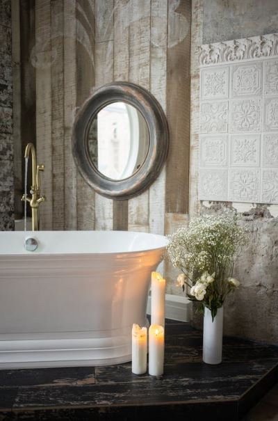 a bathroom, with candles and flowers