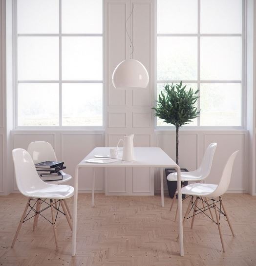 dining area with white chairs, table, and utensils