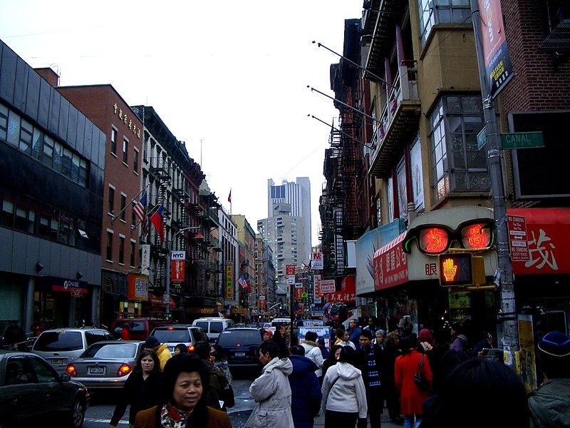 stalls and people at the intersection of Mott Street and Canal Street (Manhattan) in Chinatown
