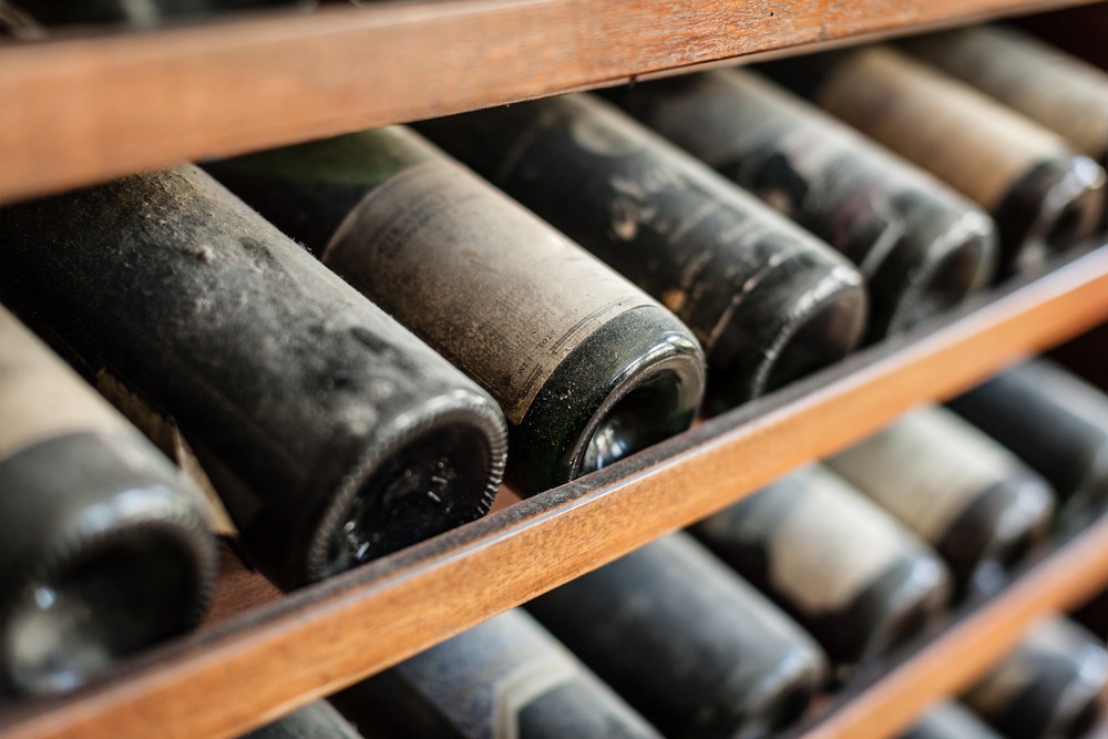 Ancient,Wine,Bottles,Dusting,In,An,Underground,Cellar