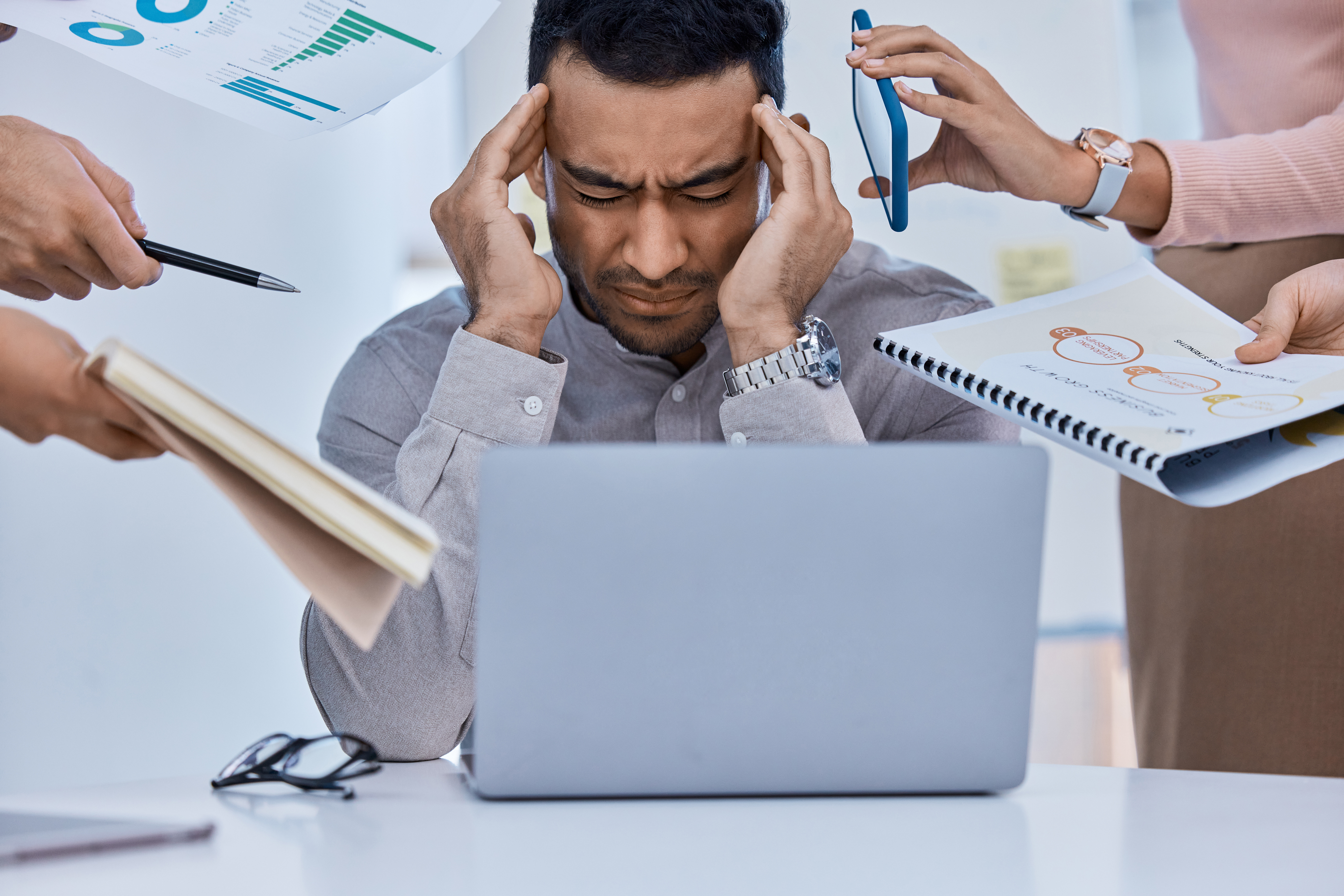 Stress, overworked and pressure for a business man with financial debt, bankruptcy or tax issues in an office. Burnout, mental health or male Latino entrepreneur with headache and feeling frustrated