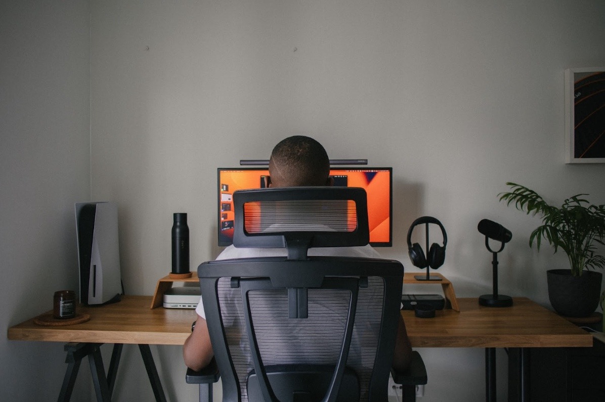 man sitting in front of computer