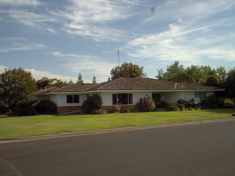 Large custom ranch house built in 1966 in Bakersfield, California. This house exhibits most of the features of the style, such as long low profile and large windows.