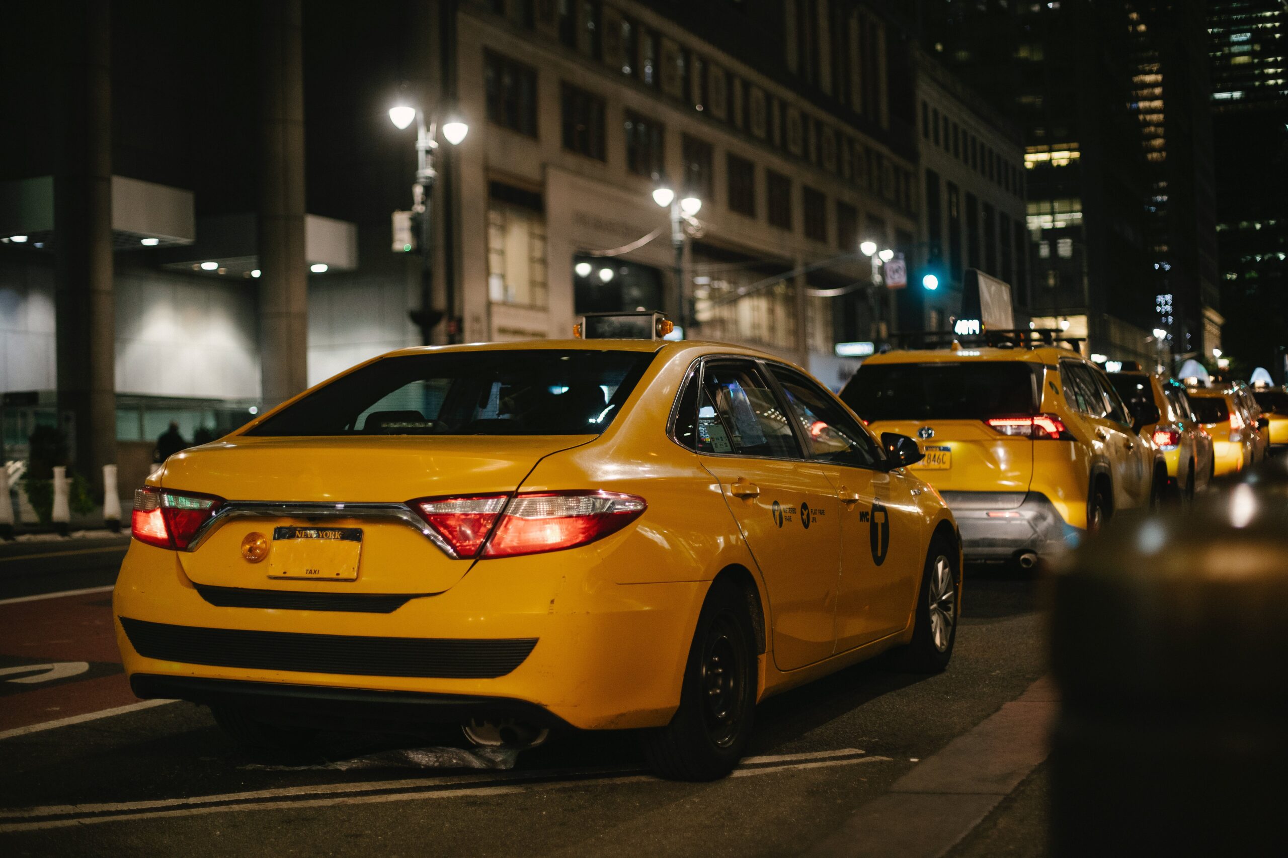 Yellow Taxis driving at night