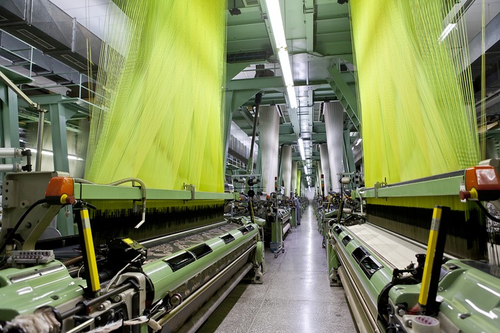 Green operating machines at a textile factory