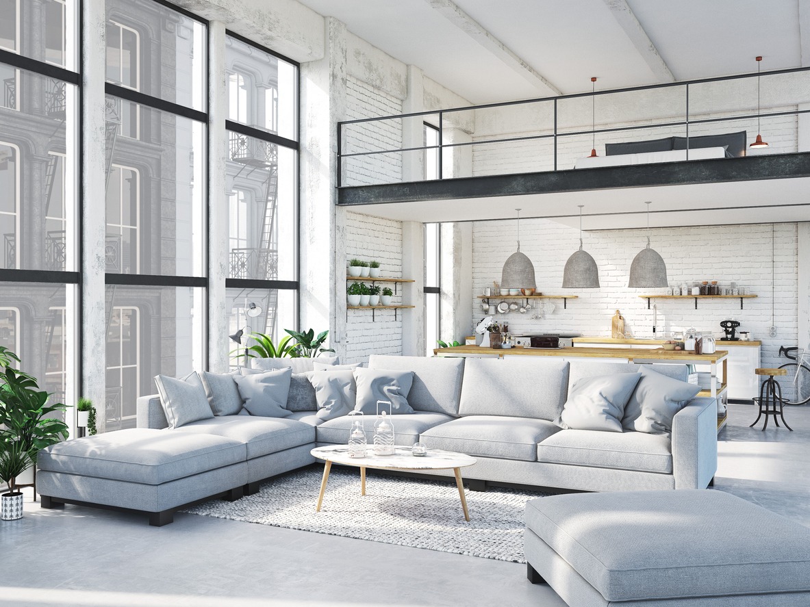loft apartment with living room and kitchen, gray sofa set and white table