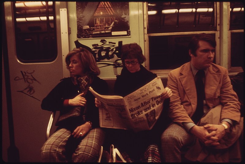 A New York City Subway passenger reading the New York Post in April 1974