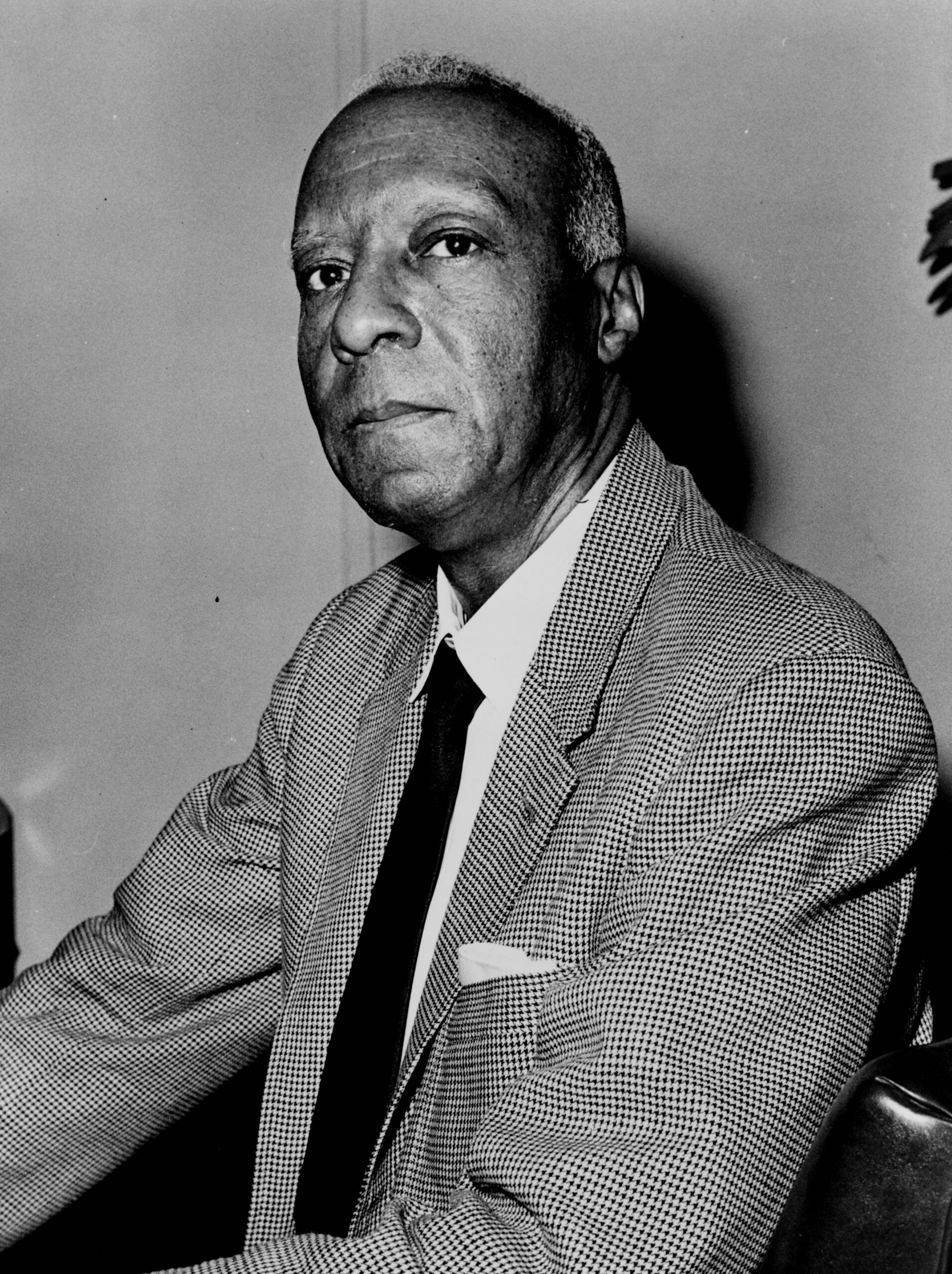 A. Philip Randolph wearing plaid suit and black tie