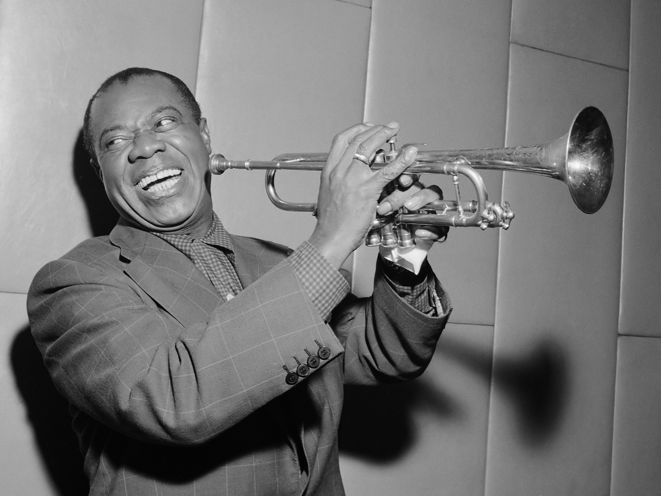 Louis Armstrong holding a trumpet