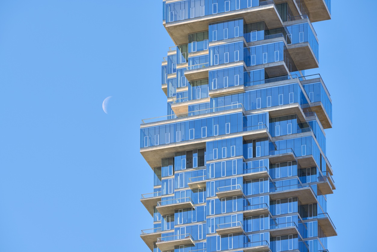Luxury building (56 Leonard Street) in the heart of Tribeca and the rising Moon, New York City
