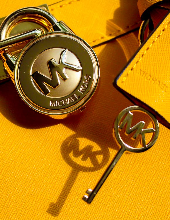 Yellow Michael Kors Bag in Close-Up Photography