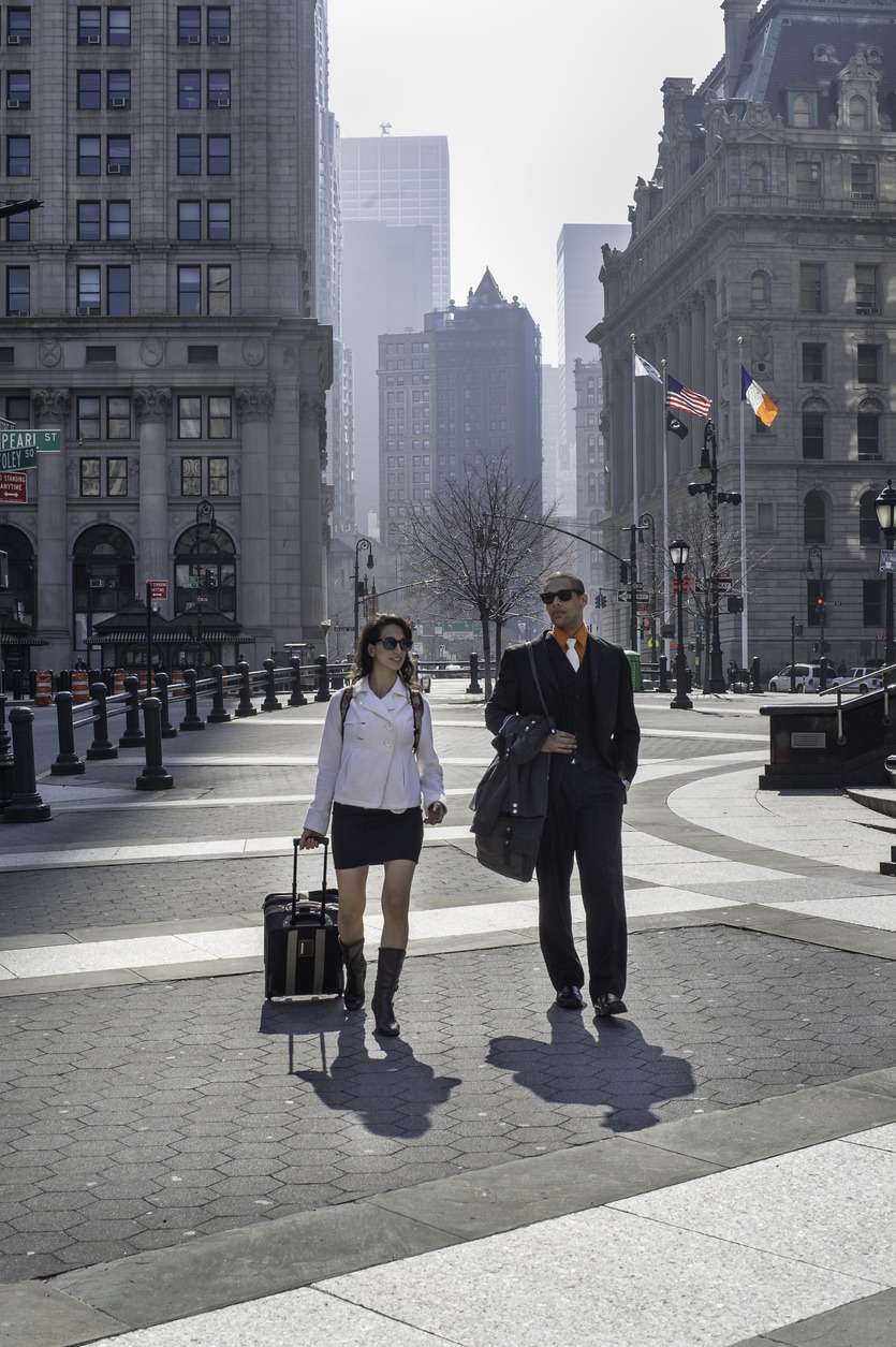 Young Businessman and Businesswoman traveling in New York