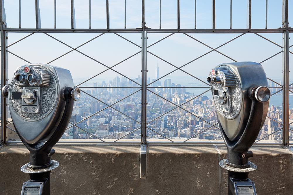 Empire State Building observation deck with two binoculars