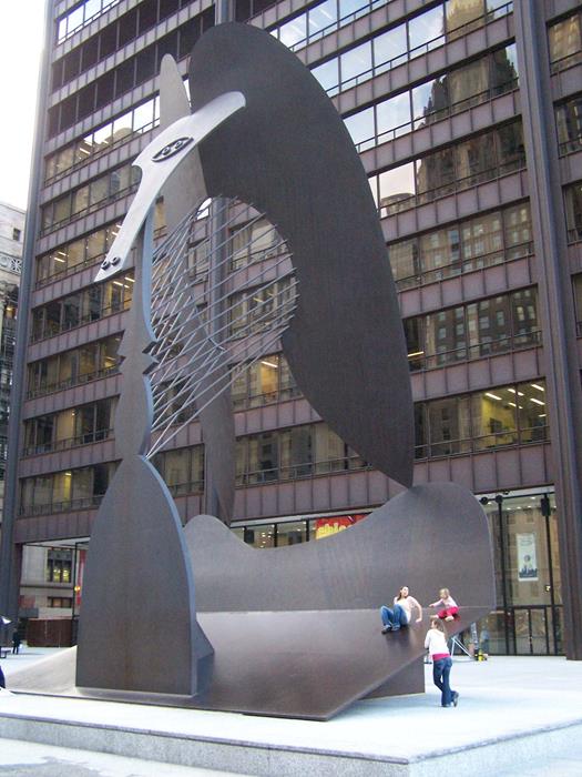 Three people on the sculpture