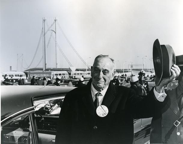 Robert Moses gives a salute after the ribbon-cutting ceremony to open the Verrazzano-Narrows Bridge on November 21, 1964