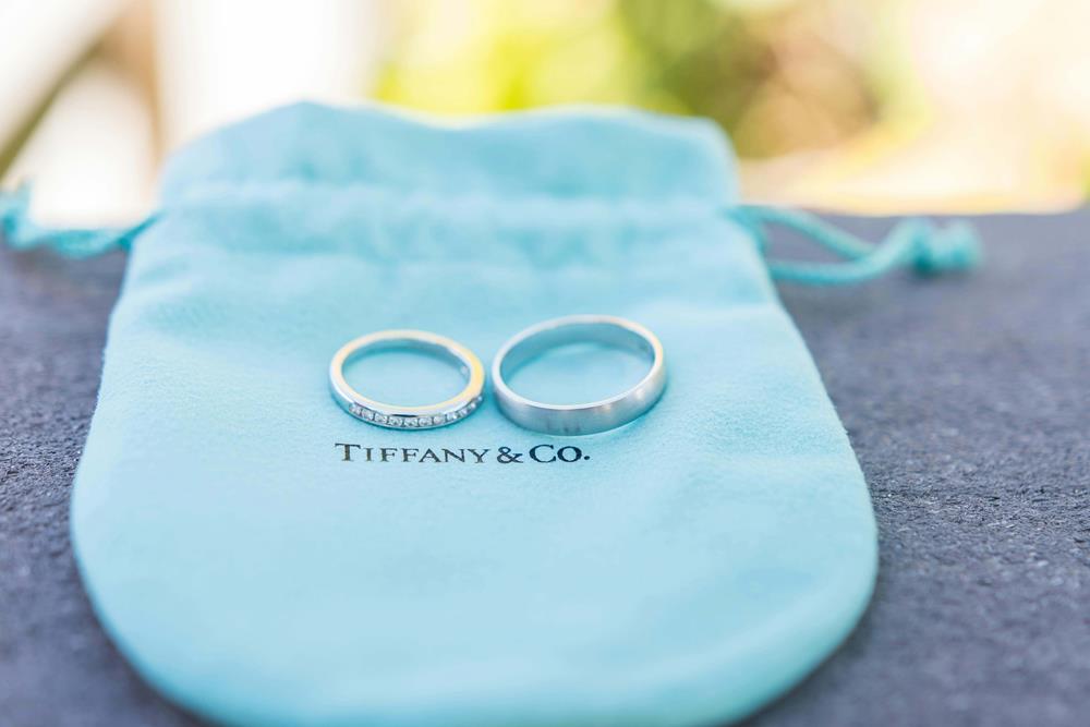 Silver Wedding Rings on Blue Pouch Bag