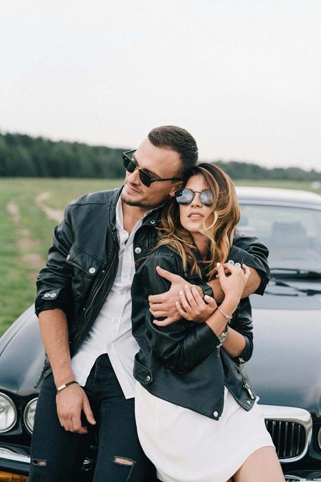 Stylish couple in sunglasses and leather jackets