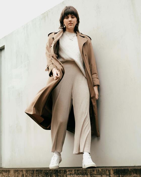 Woman in beige trench coat