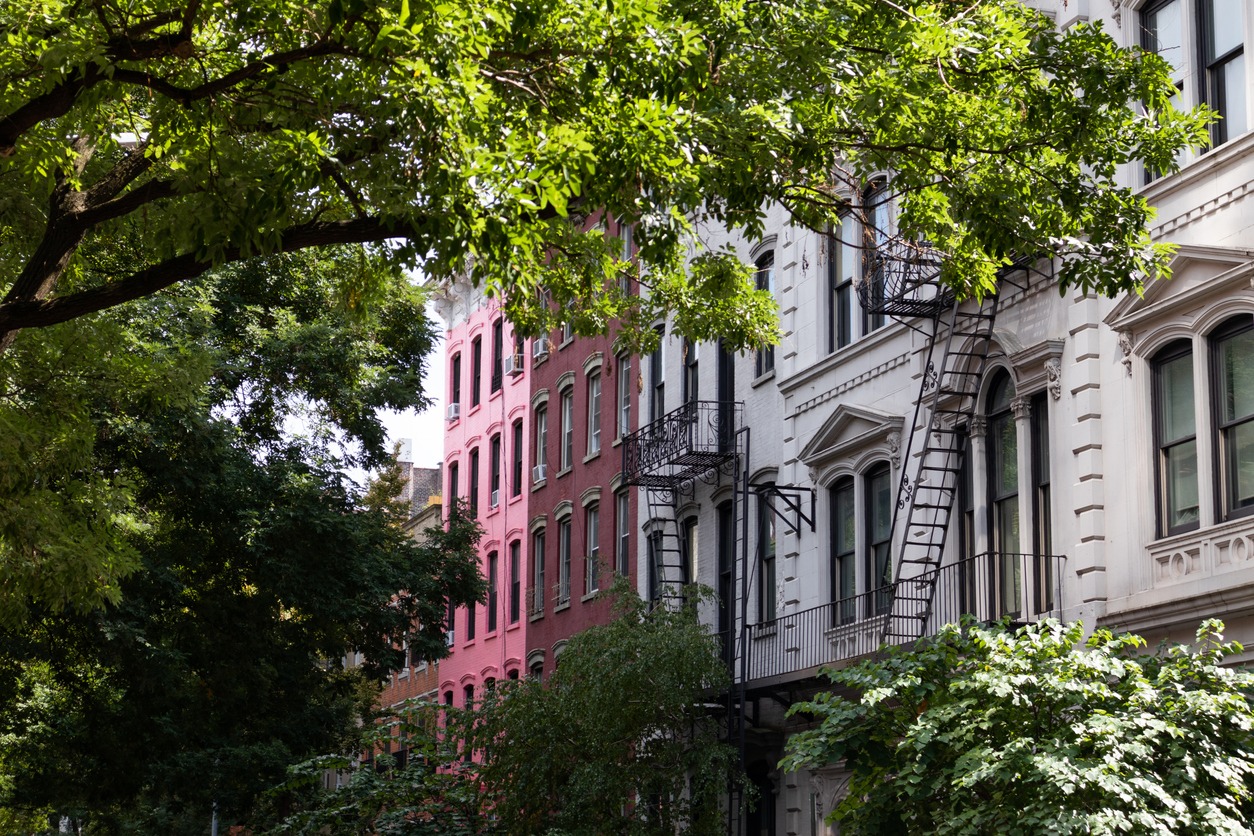 Row of Beautiful Old Residential Buildings Framed by Green Trees in the East Village of New York City